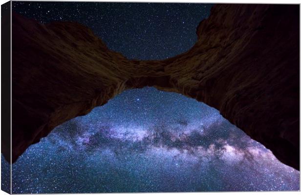 The Milkyway and the Arch  Canvas Print by John Finney