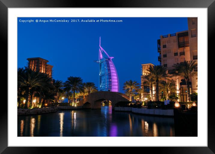 Jumeirah Mina A'Salam by night Framed Mounted Print by Angus McComiskey