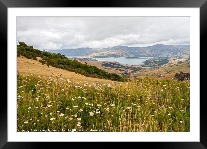 View across a meadow with wild flowers to the natu Framed Mounted Print by Kevin Hellon
