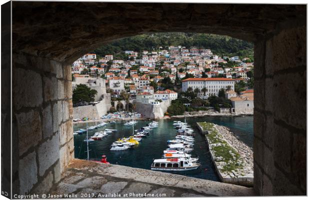 Boats in Dubrovnik's old harbour Canvas Print by Jason Wells