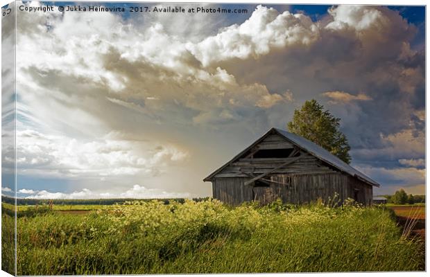 Summer Clouds Over The Barn and Fields Canvas Print by Jukka Heinovirta