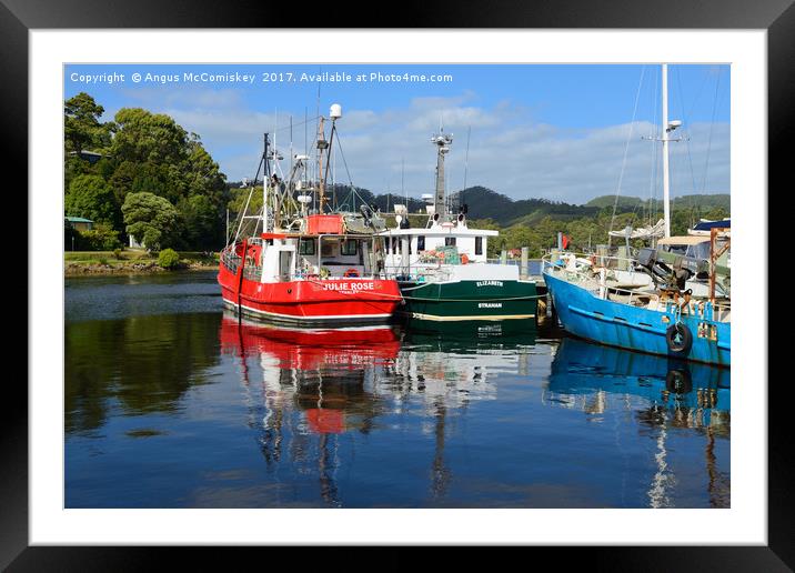 Fishing boat reflections Strahan harbour Tasmania Framed Mounted Print by Angus McComiskey