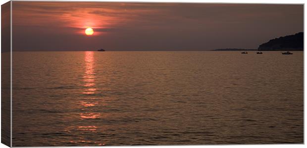 Red dusk over Pula Canvas Print by Ian Middleton