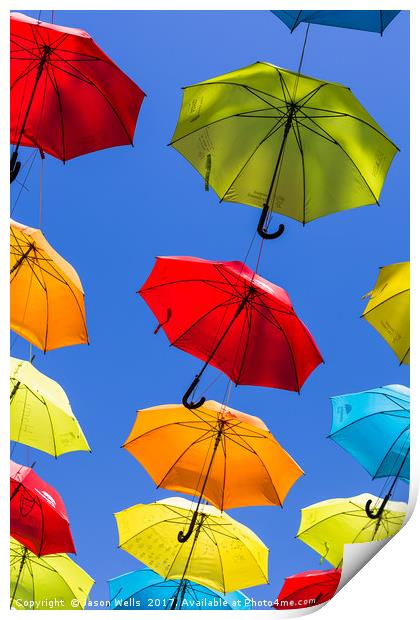 Suspended umbrellas swaying in the wind Print by Jason Wells
