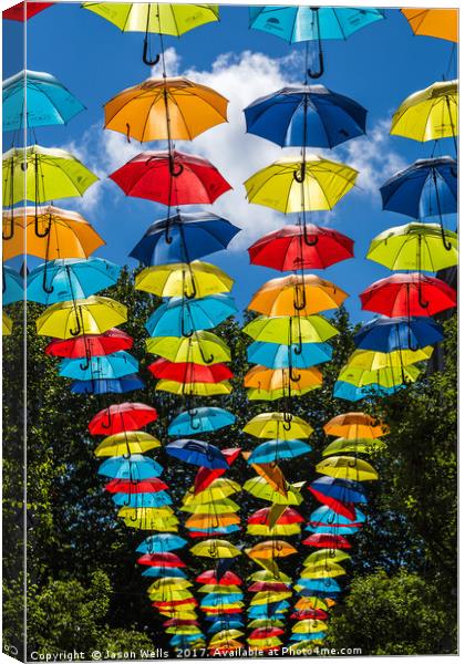 Rainbow of umbrellas hanging in Liverpool fade int Canvas Print by Jason Wells