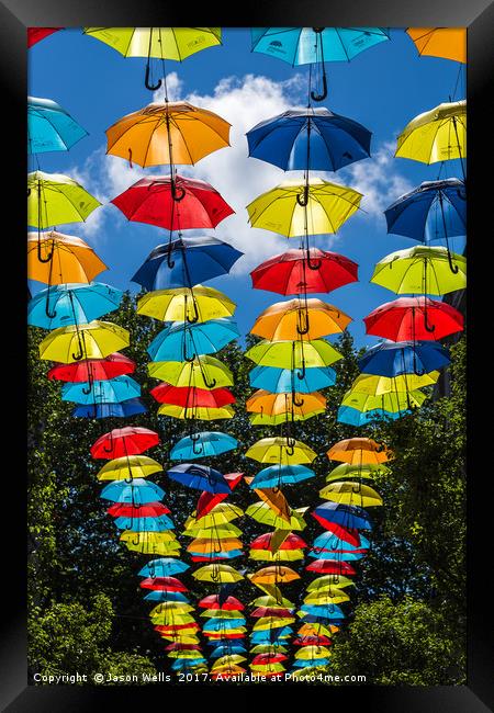 Rainbow of umbrellas hanging in Liverpool fade int Framed Print by Jason Wells