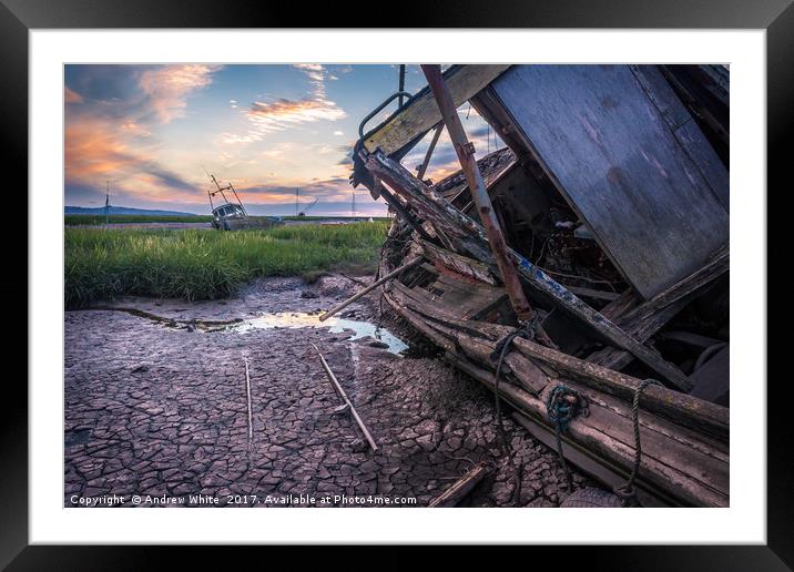 A beautiful sunset looking at an old wooden boat  Framed Mounted Print by Andrew George