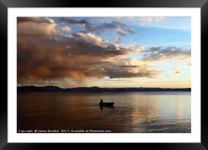 Dramatic Clouds and Fisherman on Lake Titicaca Framed Mounted Print by James Brunker