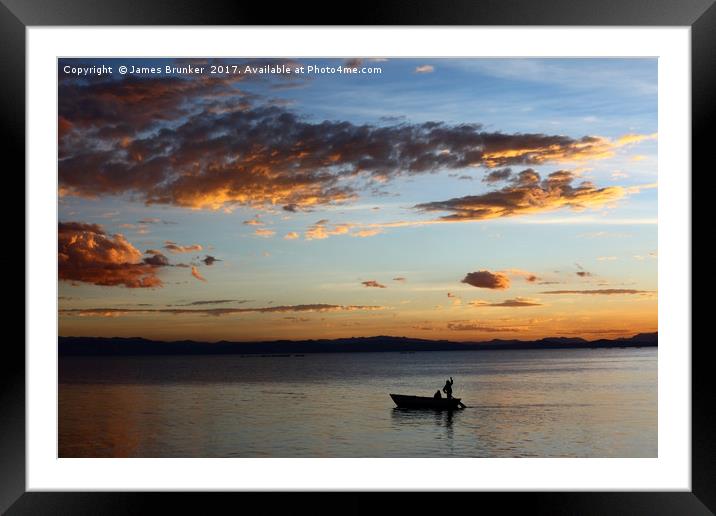 Fishing on Lake Titicaca Under a Fiery Sunset Framed Mounted Print by James Brunker