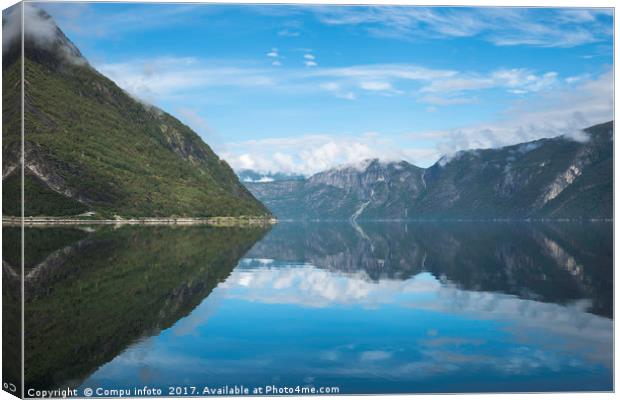 reflection of the mountains in fjord in norway Canvas Print by Chris Willemsen