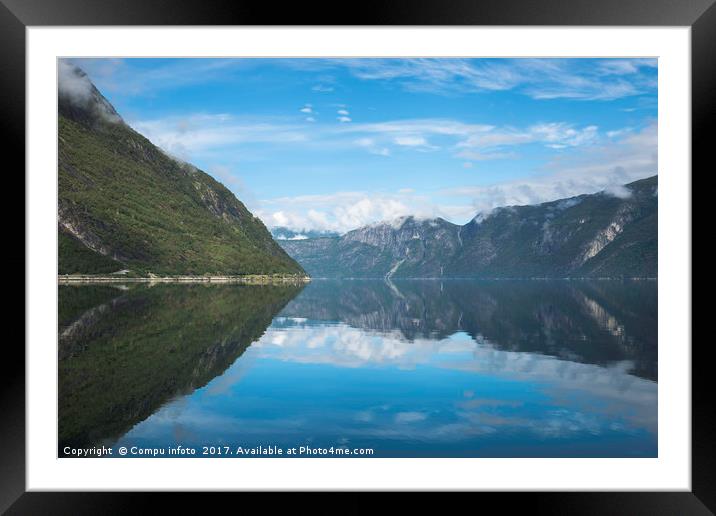 reflection of the mountains in fjord in norway Framed Mounted Print by Chris Willemsen