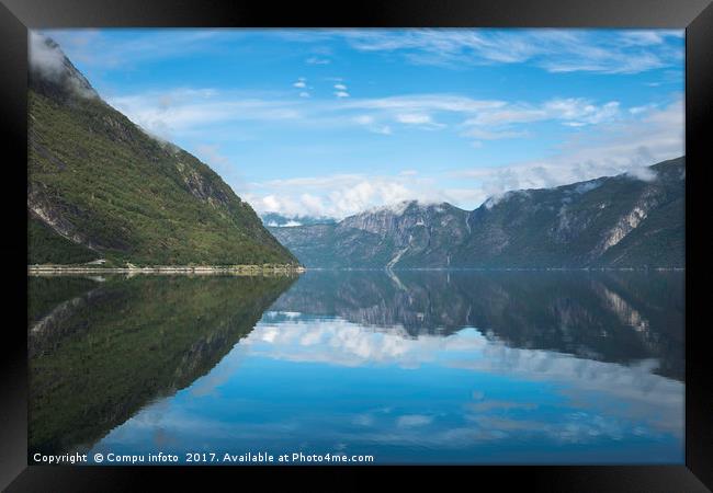 reflection of the mountains in fjord in norway Framed Print by Chris Willemsen