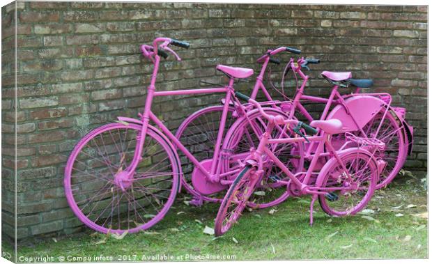 pink painted bikes and old wall Canvas Print by Chris Willemsen