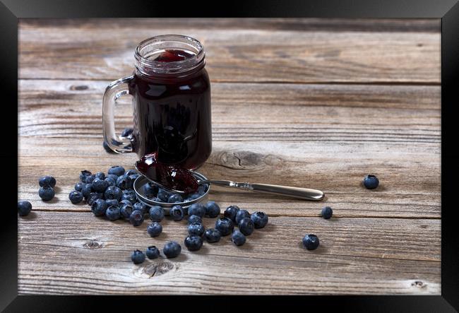 Fresh blueberry jam and berries with glass jar on  Framed Print by Thomas Baker