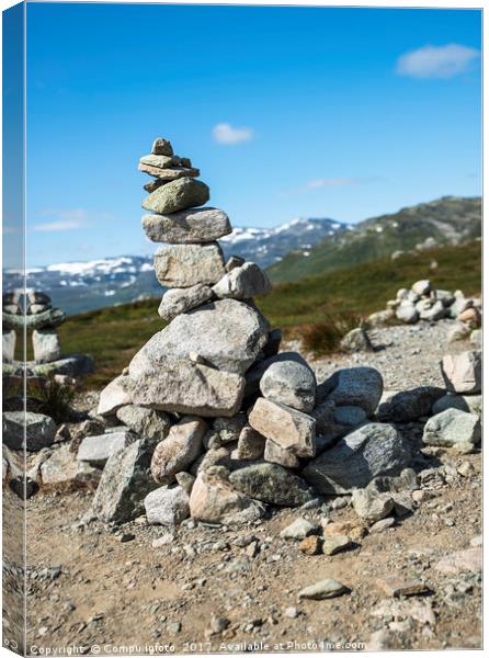 balanced stack of stones at Eidfjorden, Norway Canvas Print by Chris Willemsen