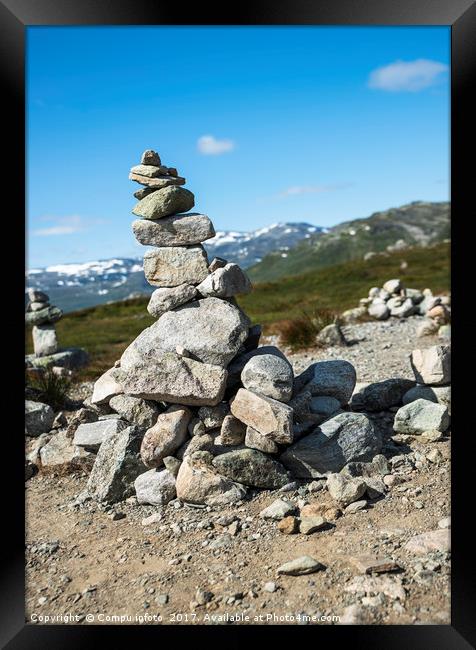 balanced stack of stones at Eidfjorden, Norway Framed Print by Chris Willemsen