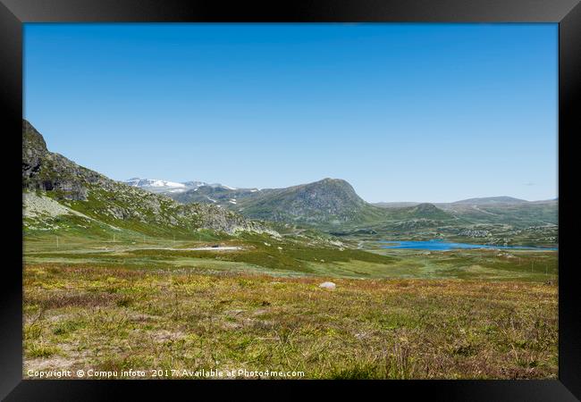 mountains in norway with blue sky background Framed Print by Chris Willemsen
