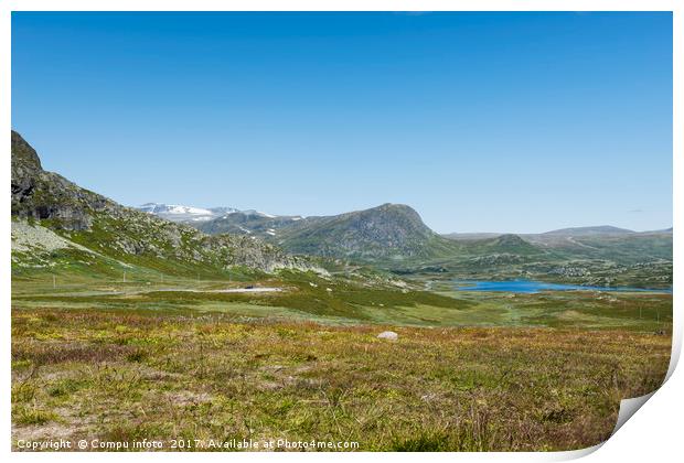 mountains in norway with blue sky background Print by Chris Willemsen