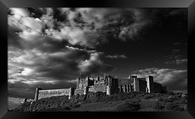 Bamburgh Castle Framed Print by Paul Davis