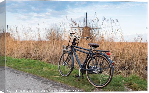 old type of bike and windmill Canvas Print by Chris Willemsen