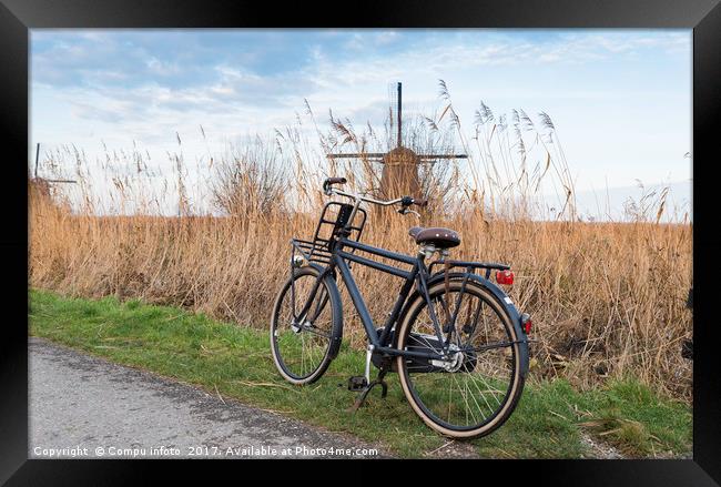 old type of bike and windmill Framed Print by Chris Willemsen