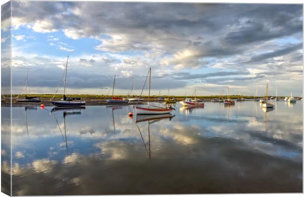 Reflections at Brancaster Staithe in Norfolk Canvas Print by Gary Pearson