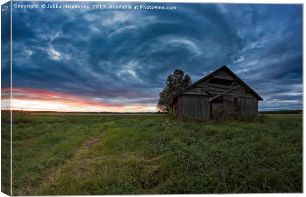 Circle Of Clouds Over The Old Barn House Canvas Print by Jukka Heinovirta
