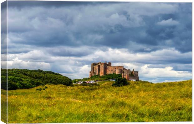 Bamburgh Castle Canvas Print by John Ellis