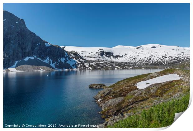 fjord with snow in summer in norway Print by Chris Willemsen