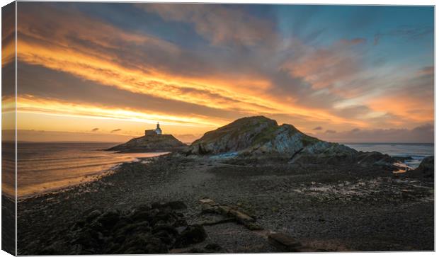 Sunrise at Mumbles lighthouse with the tide going  Canvas Print by Bryn Morgan