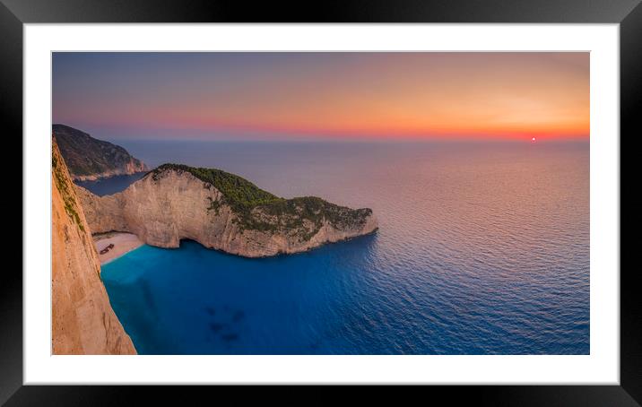 Navagio Beach - Shipwreck Cove at sunset Framed Mounted Print by Kelvin Trundle