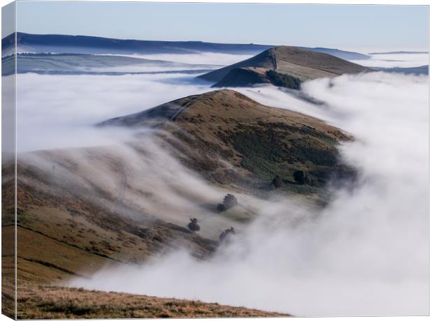 Clouds pouring over the ridge at Mam Tor during an Canvas Print by Chantal Cooper