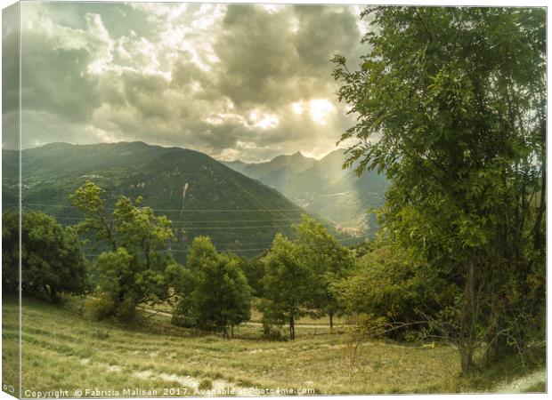 Light and shadow over the mountains Canvas Print by Fabrizio Malisan
