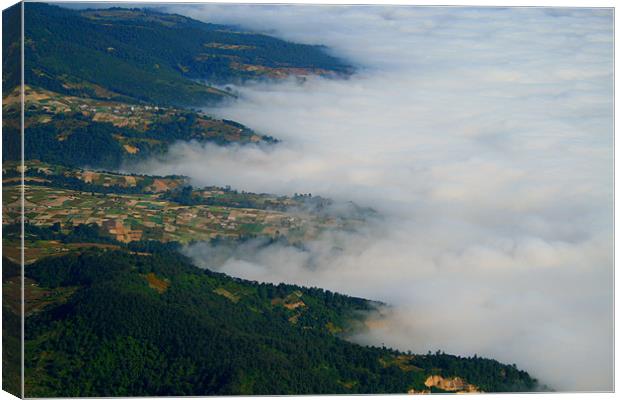 Clouds Below Canvas Print by Neil Gavin