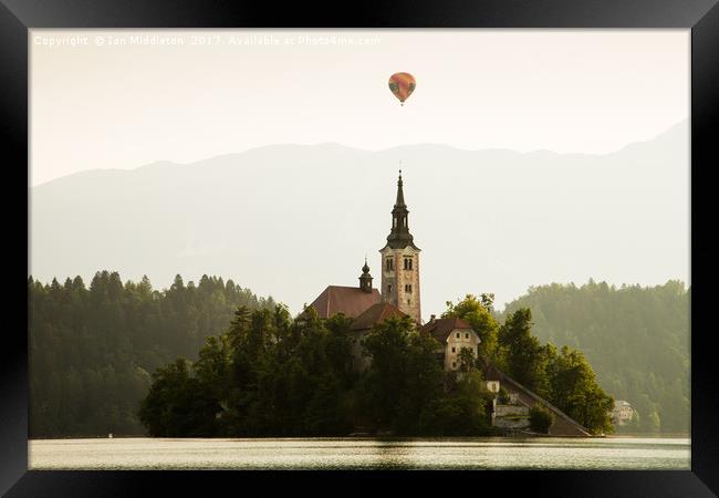 Hot air Balloon over Lake Bled and the Island chur Framed Print by Ian Middleton