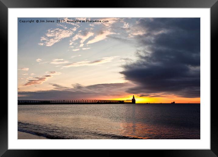 Sunrise over the piers Framed Mounted Print by Jim Jones
