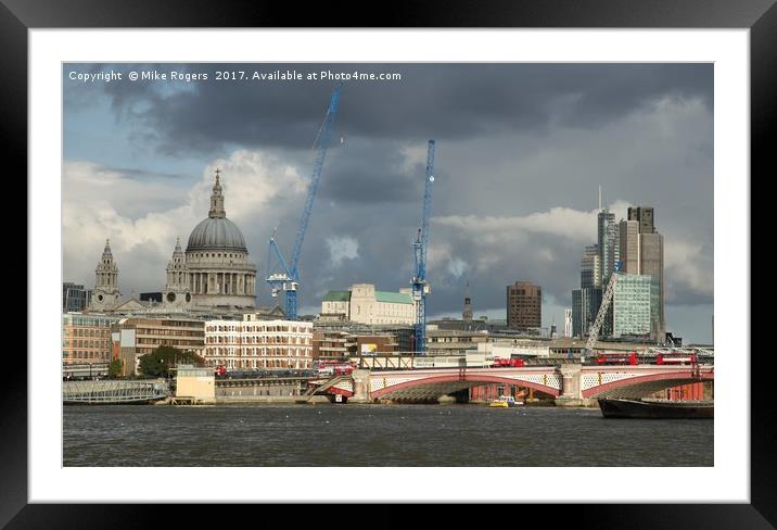 Stormy skies over the city of London Framed Mounted Print by Mike Rogers