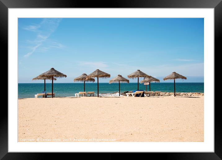 tropical parasols on the algarve beach Framed Mounted Print by Chris Willemsen