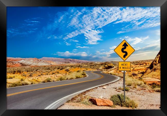 Road Sign for Curves in Desert Framed Print by Darryl Brooks