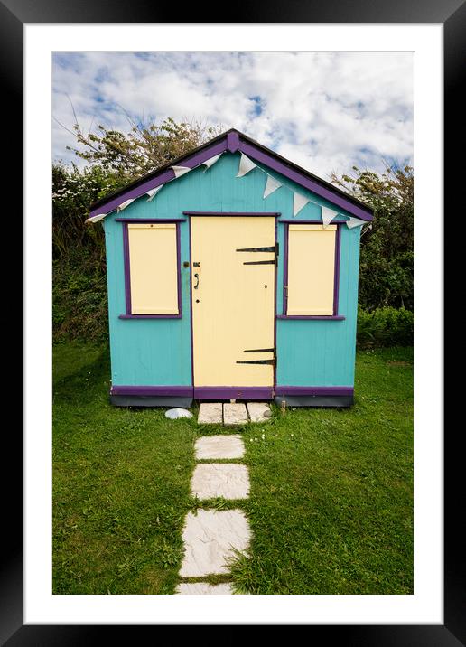Colorful beach side huts on Devon coast of England Framed Mounted Print by Steve Heap