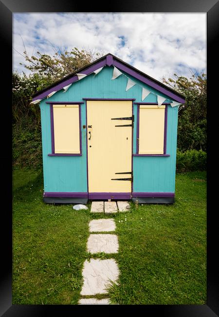 Colorful beach side huts on Devon coast of England Framed Print by Steve Heap