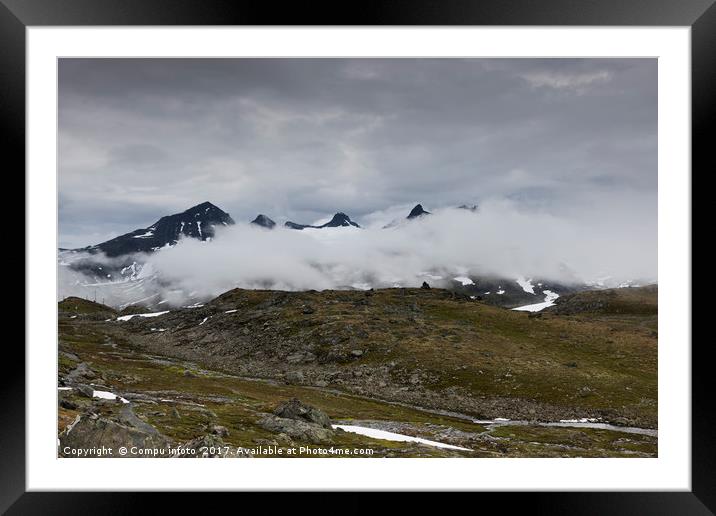 clouds and high mountain peaks Framed Mounted Print by Chris Willemsen