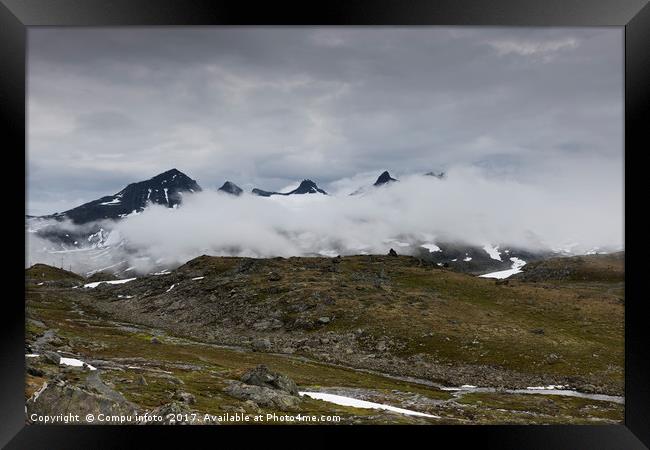 clouds and high mountain peaks Framed Print by Chris Willemsen