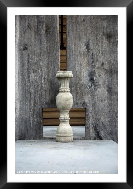 concrete vase and wooden background Framed Mounted Print by Chris Willemsen