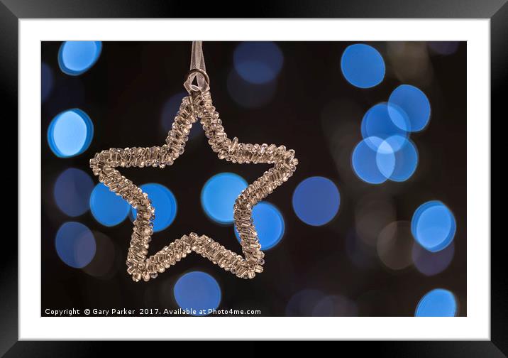 Silver Star at Christmas, against a soft focus Framed Mounted Print by Gary Parker
