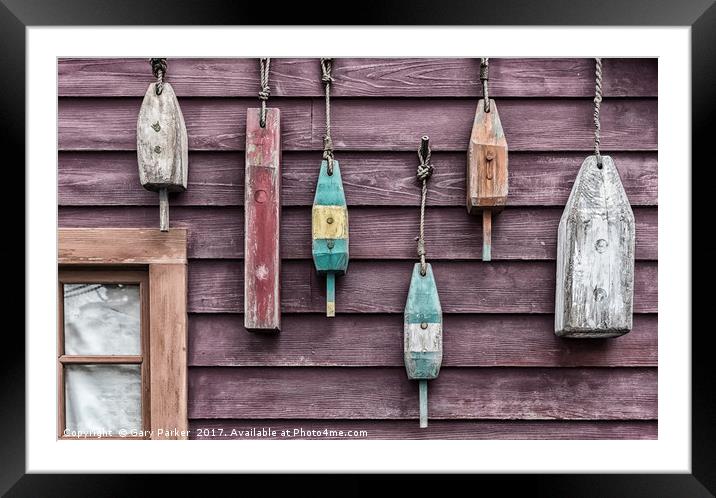 Fishing floats hanging on a wooden wall Framed Mounted Print by Gary Parker