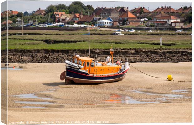 Stranded Lifeboat Canvas Print by Simon Annable