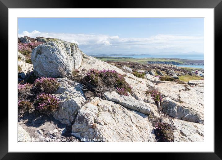 View over rocks and purple heather Framed Mounted Print by Kevin Hellon
