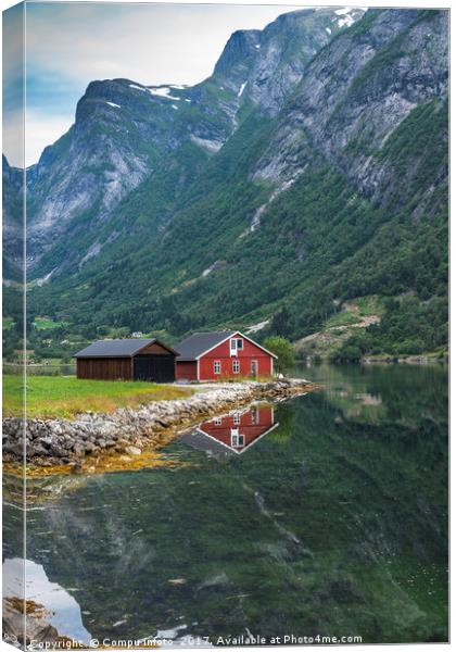 red wooden house at norway fjord Canvas Print by Chris Willemsen