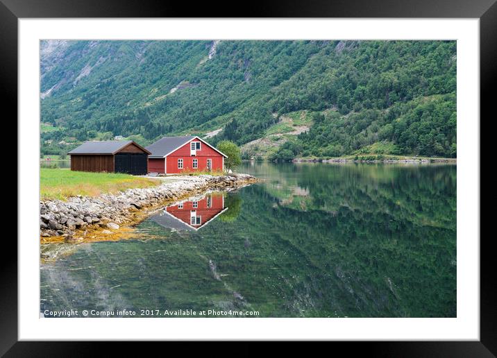 red wooden house at norway fjord Framed Mounted Print by Chris Willemsen
